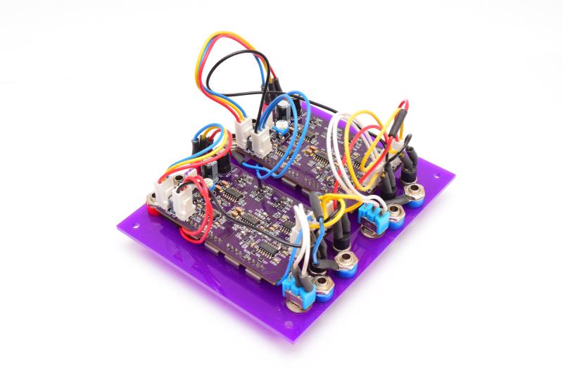 The back of the module, showing two purple boards mounted to the back of the panel