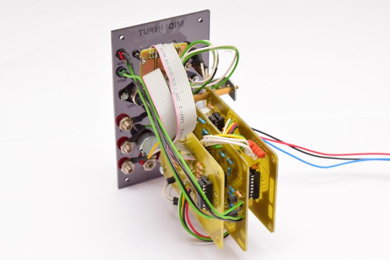 MIDI input module seen from the back, showing 3 stacked PCBs