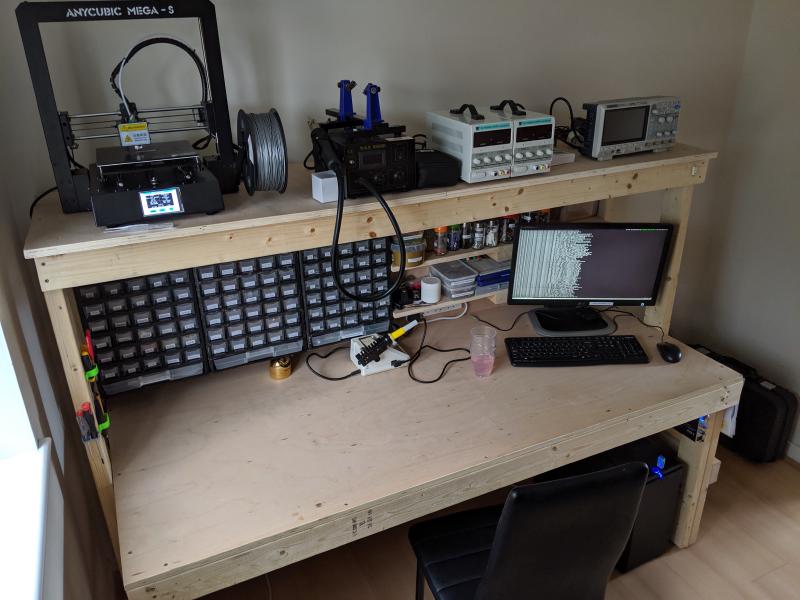 Photo of the finished workbench, with various equipment and component trays installed